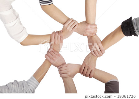 Group of Chinese friends with hands in circle Group of Chinese friends with hands in circle 19361726