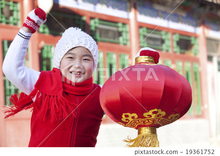 Young boy holding red lantern 19361752