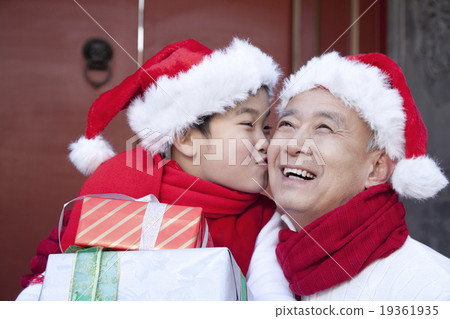Grandpa and grandson holding Christmas Gifts 19361935