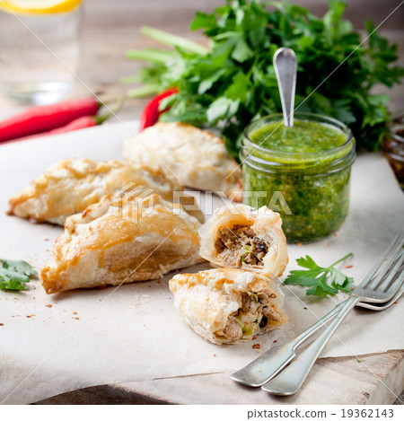 Empanadas with meat and green chili sauce Empanadas with meat and green chili sauce 19362143
