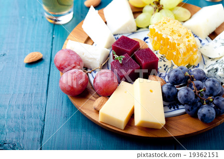 Cheese plate with fresh grape, honey, plum jelly Cheese plate with fresh grape, honey, plum jelly 19362151