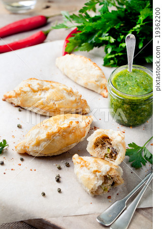 Empanadas with meat and green chili sauce Empanadas with meat and green chili sauce 19362200