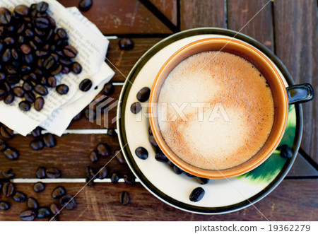 Cup of coffee, cappuccino with beans and a book. Cup of coffee, cappuccino with beans and a book. 19362279