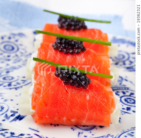 Smoked salmon rolls cream cheese, black caviar 19362321