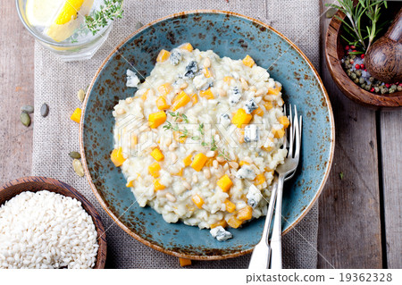 Pumpkin, blue cheese risotto in a ceramic plate 19362328