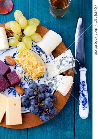Cheese plate with fresh grape, honey, plum jelly Cheese plate with fresh grape, honey, plum jelly 19362457