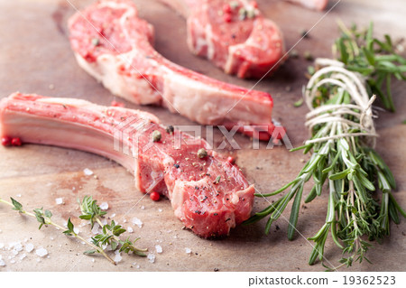 Raw meat, mutton, lamb rack on a wooden background 19362523