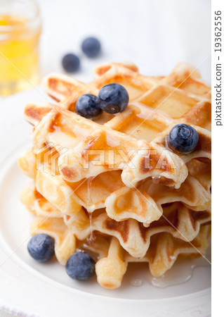 Fresh waffles with blueberries, maple syrup Fresh waffles with blueberries, maple syrup 19362556
