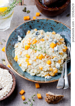 Pumpkin, blue cheese risotto in a ceramic plate Pumpkin, blue cheese risotto in a ceramic plate 19362629