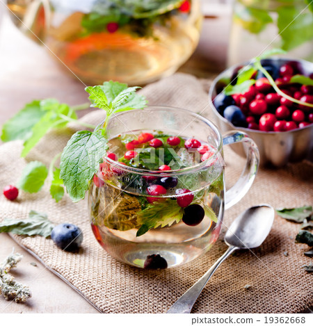 Herbal tea with fresh berries. Romantic background Herbal tea with fresh berries. Romantic background 19362668