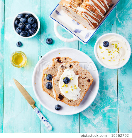 Banana bread with cream cheese frosting, honey 19362792