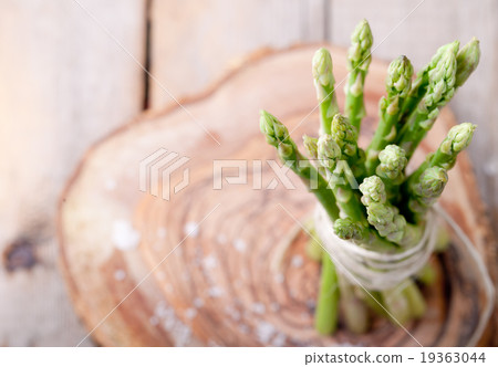 Fresh asparagus on a wooden background Fresh asparagus on a wooden background 19363044