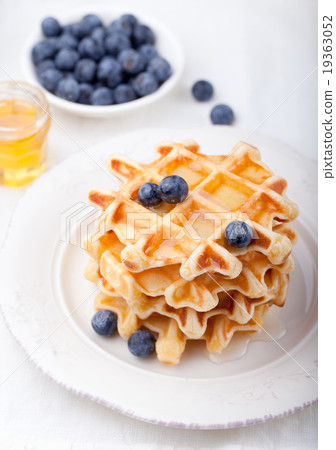 Fresh waffles with blueberries, maple syrup Fresh waffles with blueberries, maple syrup 19363052