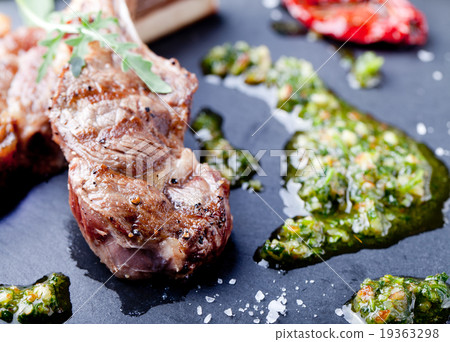 Grilled meat, mutton, lamb rack with fresh salad. 19363298