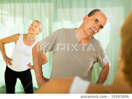 Elderly couple with trainer Elderly couple with trainer 19363806