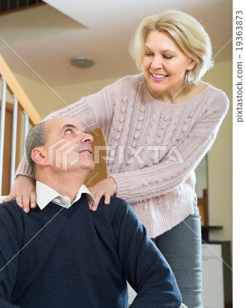 Senior couple making a back massage Senior couple making a back massage 19363873