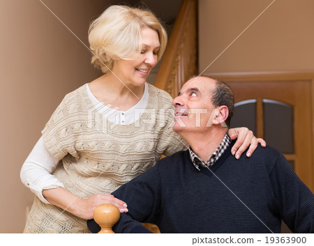 Mature couple near staircase 19363900