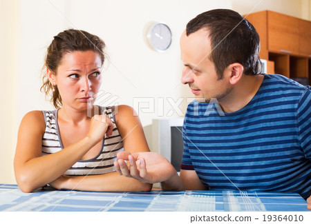 Sad partner asking forgiveness 19364010