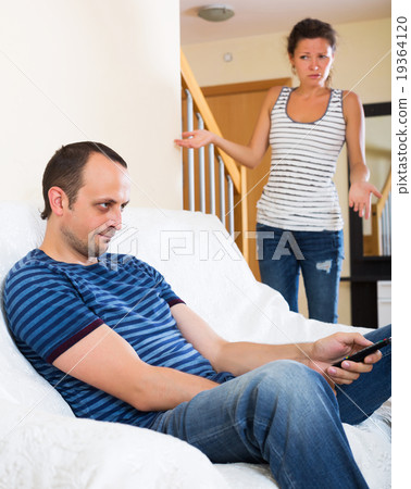 Sad partner asking for forgiveness 19364120