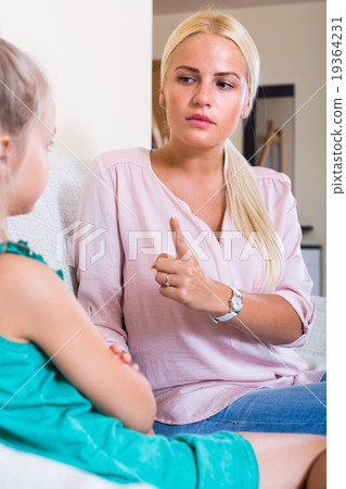 Woman scolding little daughter Woman scolding little daughter 19364231