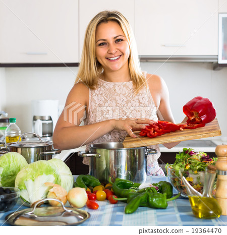 Woman cooking vegetables in kitchen 19364470
