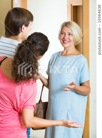 Mature woman visiting adult kids at their place 19364636