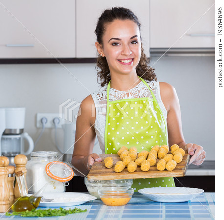 woman rolling filled croquettes woman rolling filled croquettes 19364696
