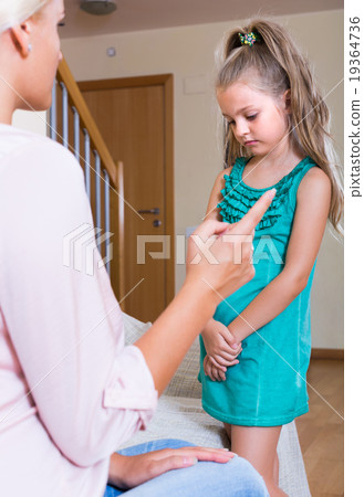 Woman scolding little daughter at home Woman scolding little daughter at home 19364736