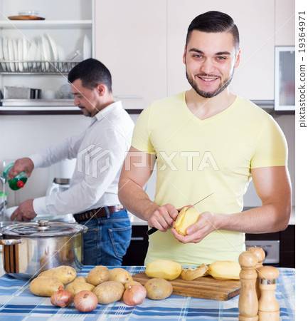men cooking potato soup 19364971