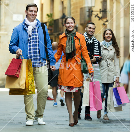 Group of adults with shopping bags Group of adults with shopping bags 19365138