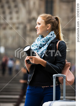 Young female traveller with camera Young female traveller with camera 19365339