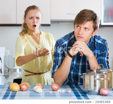 man and frustrated housewife having bad argument 19365369