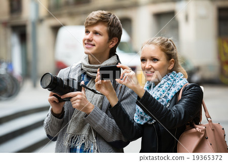 Tourists making photo at streets. 19365372