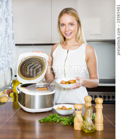 Happy housewife cooking 19365481
