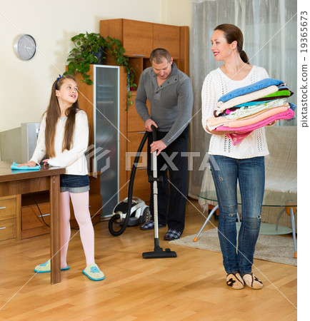 Mother, father and girl doing general cleaning 19365673