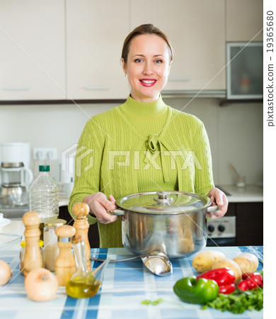 girl cooking soup 19365680