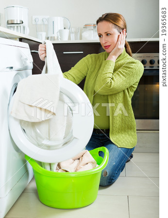 Woman with washing machine Woman with washing machine 19365683
