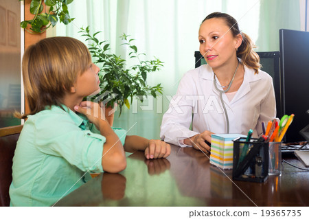 Doctor with teenager patient Doctor with teenager patient 19365735