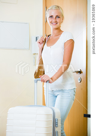 Portrait of female traveller going at holiday trip 19365869