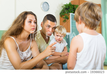 Parents scolding child in home Parents scolding child in home 19366023