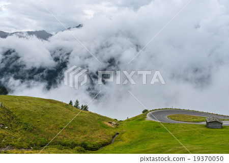 The Grossglockner mountains in foggy weather The Grossglockner mountains in foggy weather 19370050