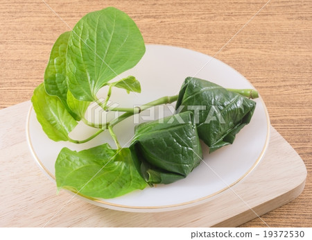 Betel Leaf Wrapped Bite Size Appetizer on A Dish Betel Leaf Wrapped Bite Size Appetizer on A Dish 19372530