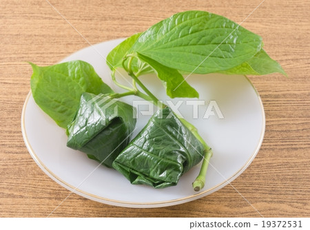 Plate of Betel Leaf Wrapped Bite Size Appetizer Plate of Betel Leaf Wrapped Bite Size Appetizer 19372531