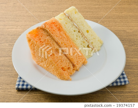 Vanilla and Orange Chiffon Cake on A Dish 19374157