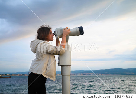 Woman look in pay binocular 19374658