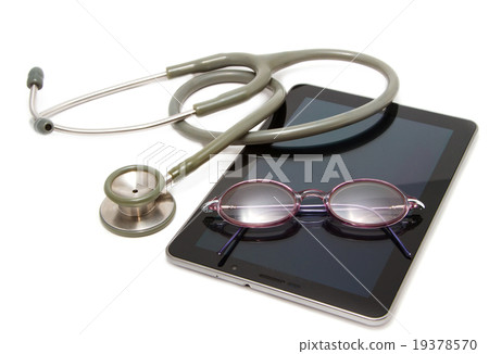 stethoscope and glasses rest on tablet 19378570