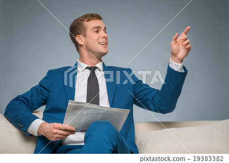 Handsome man with newspaper. Handsome man with newspaper. 19383382