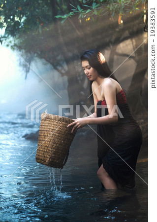 Asian women working in creek Asian women working in creek 19383591
