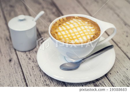 Cappuccino coffee in white cup on wood background 19388683