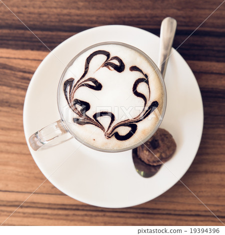 A cup of coffee on wooden background 19394396